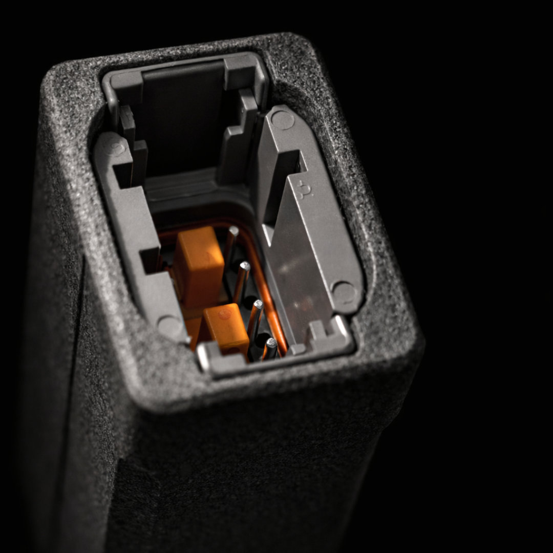 Close-up of the BOD connector cavity showing terminal pins and orange lock features