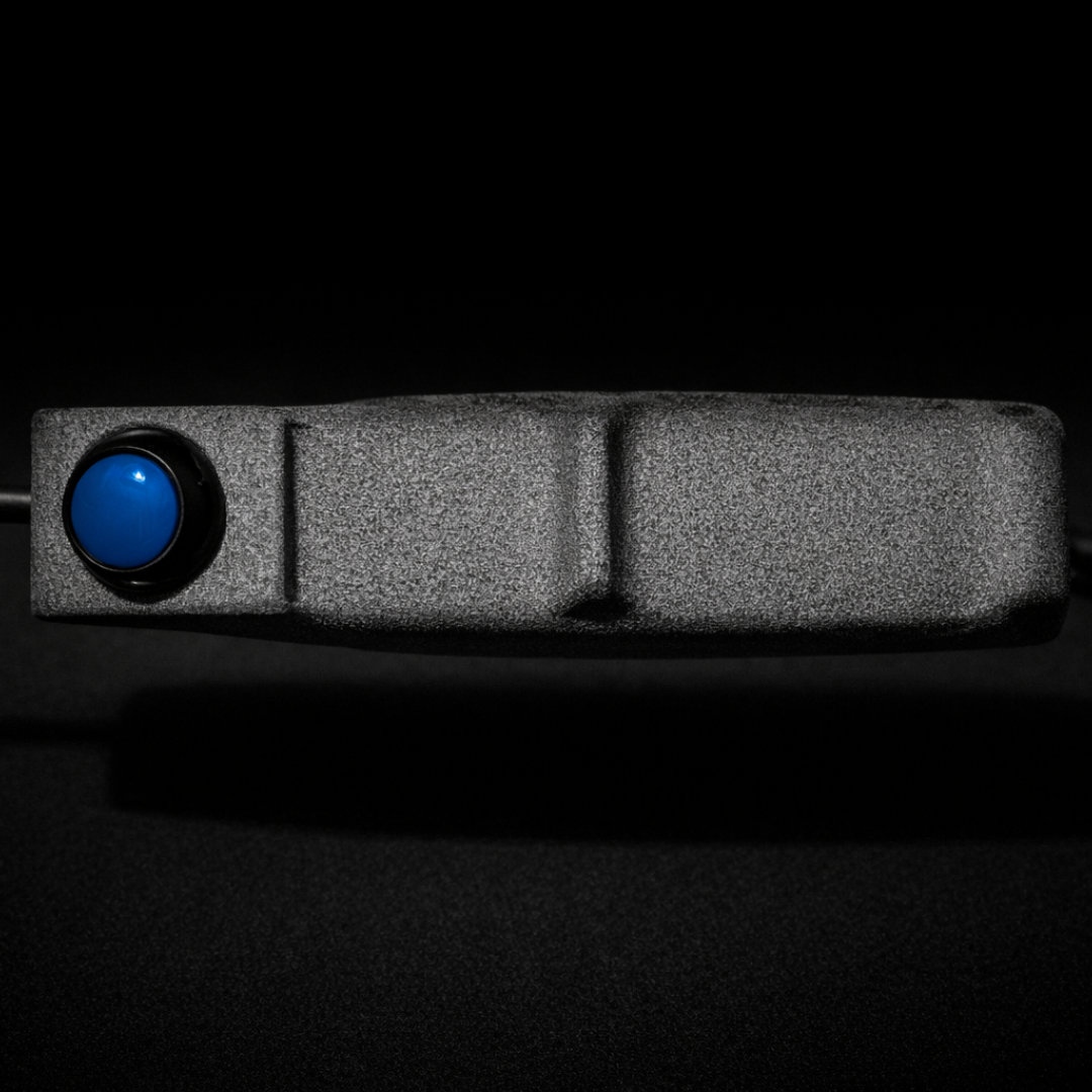 Side profile view of the PGB grip with blue button